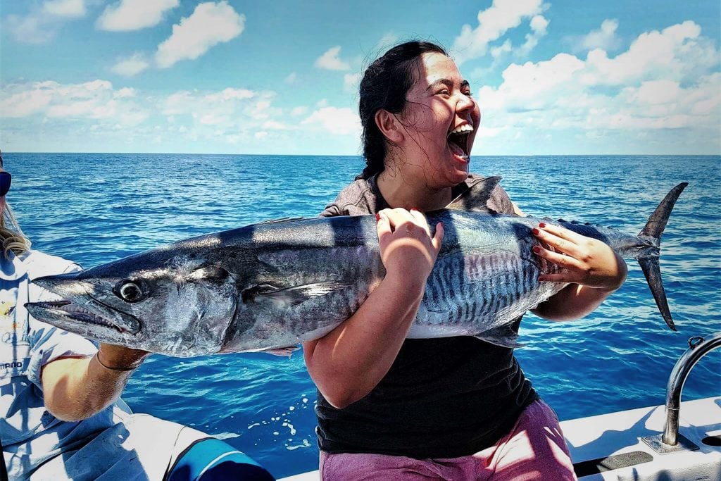 excited girl caught a fish