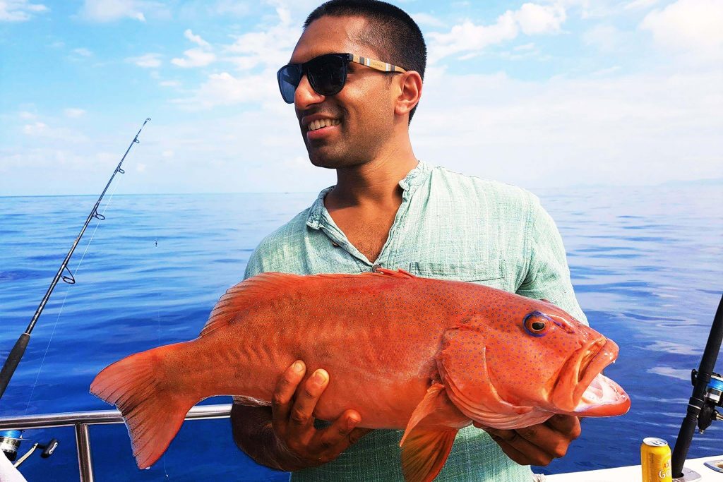 man fishing for coral trout