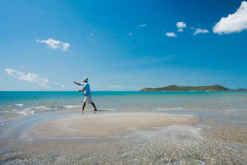 man fishing at the beach