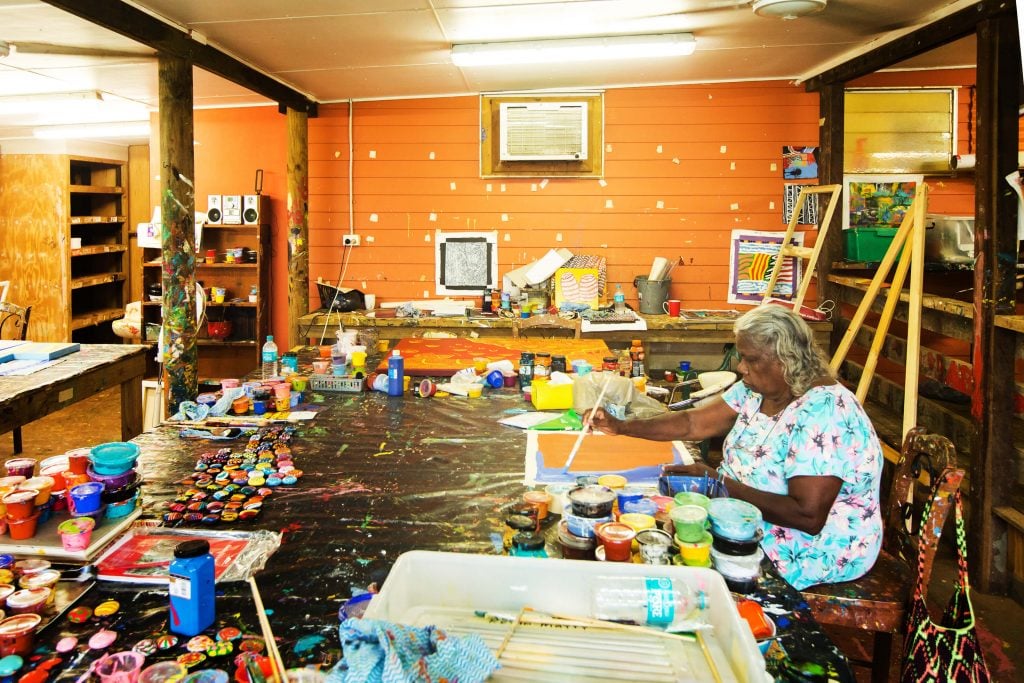 Artist at work in the HopeVale Arts & Cultural Centre