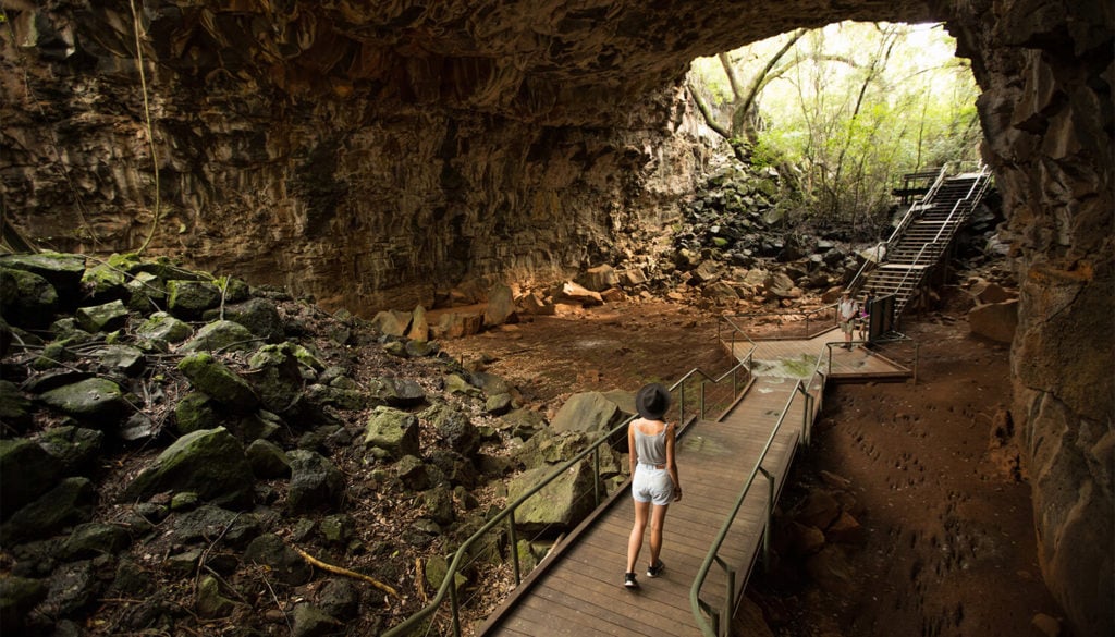 Young woman inside lava tube at Undara Volcanic National Park