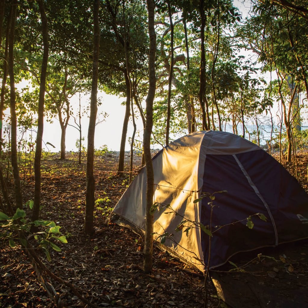 Camping near the water at sunrise